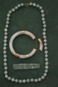 A Chinese jade bead necklace and similar items.