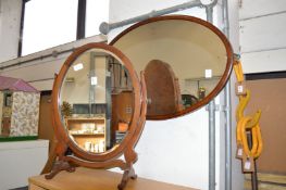 A dressing table mirror and a wall mirror.