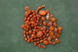 An amber bead necklace etc.
