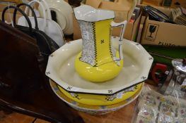 A wash jug and bowl and another bowl.