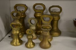 A collection of brass weights.