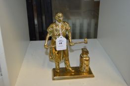 A cast brass model of a blacksmith.