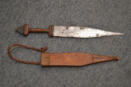 An African dagger with leather sheath.