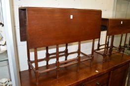 A mahogany spider leg table.