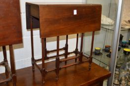 A small mahogany spider leg drop-leaf table.