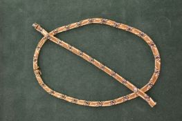 An 18ct gold necklace and matching bracelet.