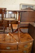 A 19th century mahogany tilt top tripod table and a modern tripod table.