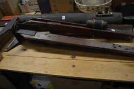 A large early telescope and tripod stand (AF).