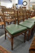A set of four oak dining chairs.