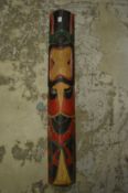 A carved wood and painted tribal mask.