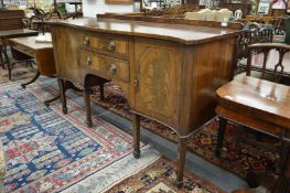 A George III style mahogany serpentine fronted sideboard.
