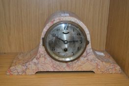 A decorative mantle clock.