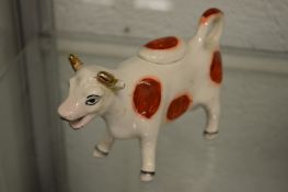 A Staffordshire cow creamer.