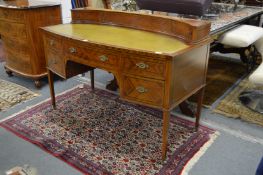 A good Edwardian mahogany bow front desk with super-structure, gilt tooled leather inset writing