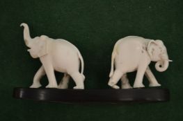 A pair of carved elephants.