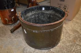 A large copper coal or log bucket.