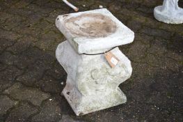 A composite garden pedestal.