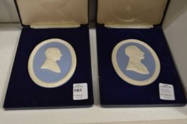 Two Wedgwood Jasper ware plaques, boxed.