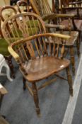 A 19th century ash and elm low back Windsor armchair.