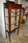 An Edwardian display cabinet.