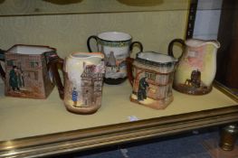 Five Royal Doulton Series Ware jugs and loving cups.
