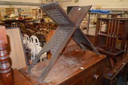 A carved hardwood folding Quran stand.