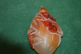 A Chinese carved agate snuff bottle.