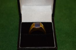 An 18ct gold and gem set ring.
