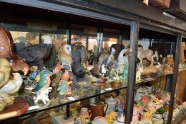 A large quantity of decorative figures of animals, birds, David Winter cottages etc.