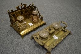 Two decorative brass desk stands with cut glass inkwells.