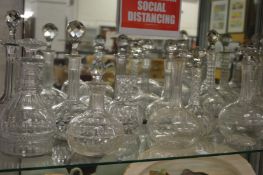 A collection of decanters and stoppers.