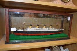 A cased model of a steam ship.