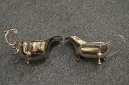 Two silver sauce boats.