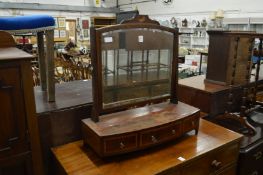 A mahogany bow front dressing table mirror.