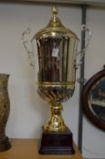 A large plated trophy cup.