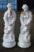 A pair of large white painted composite classical garden female figures.