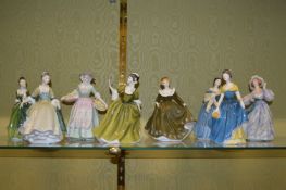 Eight Royal Doulton figurines.