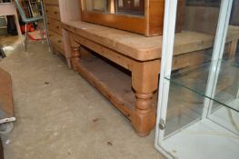 A chunky pine two tier coffee table.