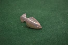 An engraved silver napkin clip.