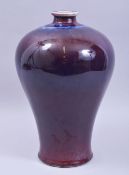 A CHINESE COPPER RED / FLAMBE MEIPING VASE, 33cm high.