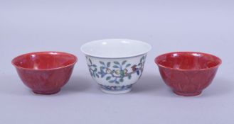 THREE CHINESE PORCELAIN TEA CUPS, including one cup in the doucai palette with six character mark