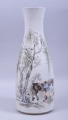 A LARGE CHINESE PORCELAIN BOTTLE VASE, painted with a figure grooming two horses beside a tree,