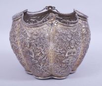 A THAI EMBOSSED AND CHASED LOBED SILVER BASKET, with embossed and chased panels of deities and