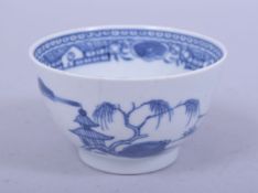 A CHINESE BLUE AND WHITE PORCELAIN CUP, decorated with a landscape scene of buildings, 8cm