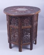 A GOOD MOORISH BONE INLAID CIRCULAR TABLE, carved with two bands of grape and vine and ornate