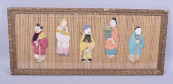 A FRAMED COLLECTION OF FIVE SILK CHINESE FIGURES, framed and glazed, overall 28cm x 63.5cm.