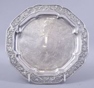A CHINESE SILVER OCTAGONAL SHAPED WAITER BY WANG HIN, the border embossed with birds amongst bamboo,