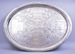 A LARGE INDIAN KASHMIRI ENGRAVED SERVING DISH, with scenes of mosques and native scrolling