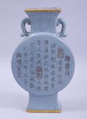 A CHINESE CELADON CRACKLE GLAZE TWIN HANDLE VASE, with incised calligraphy to one side, four