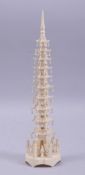A 19TH / 20TH CENTURY CARVED IVORY SHRINE / TOWER, 26.5cm high.